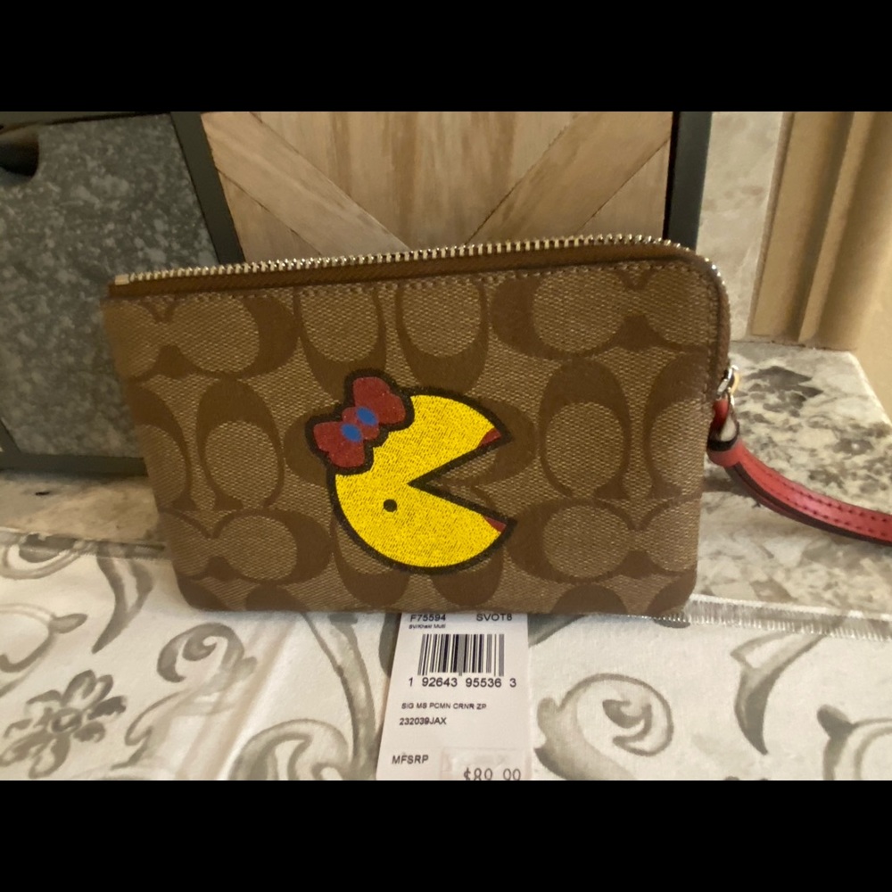 Coach corner zipper logo with Ms Pac-Man wristlet